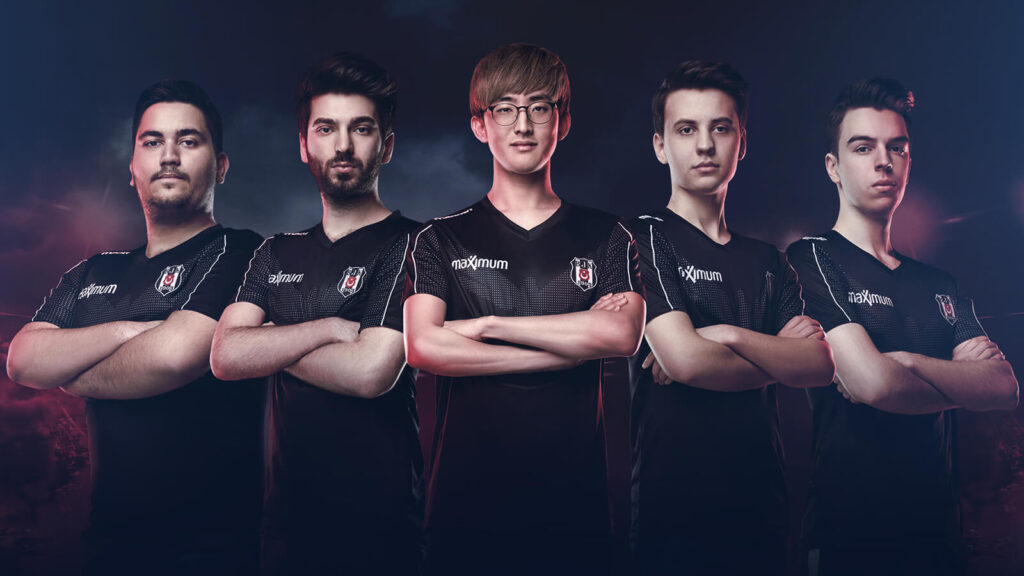 Beşiktaş LoL Esports Team lineup standing in a dramatic gaming-inspired setting, wearing official team jerseys.