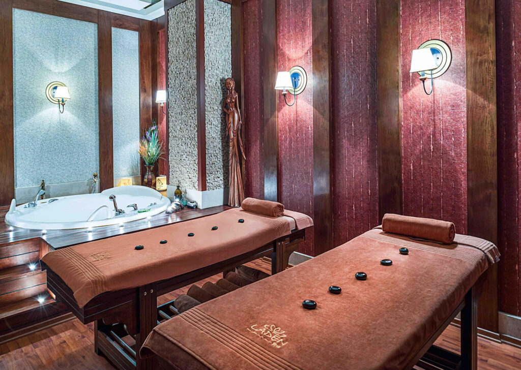 Luxury Spa Massage Room with hot stone beds and jacuzzi at Delphin Diva Hotel Antalya.