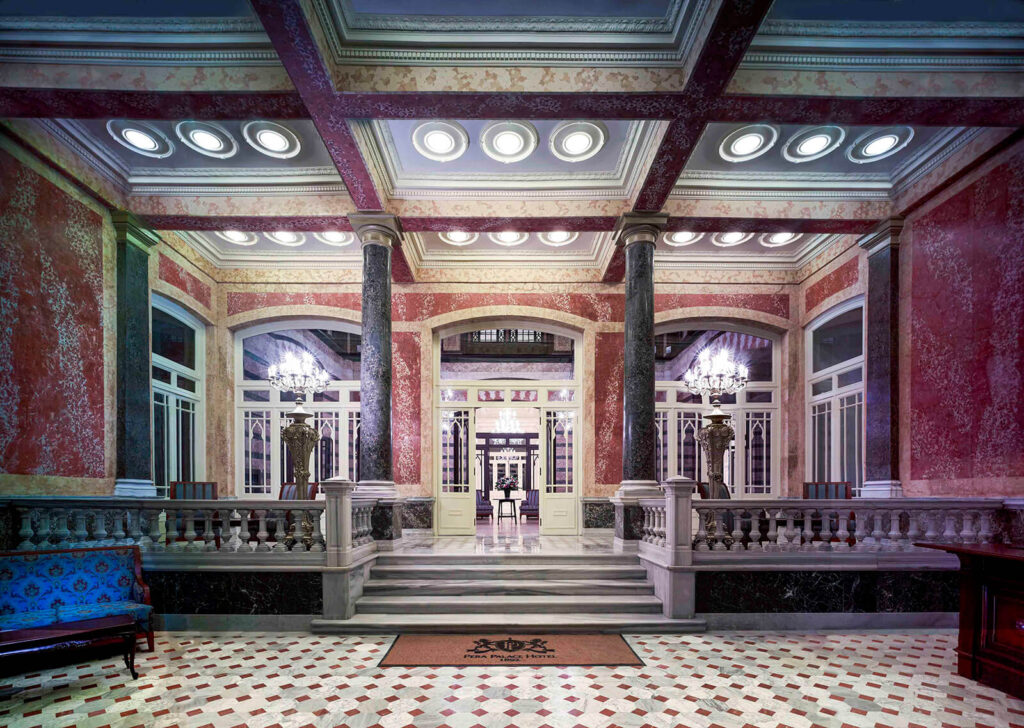 Grand lobby of Pera Palace Hotel in Istanbul showcasing opulent architecture and luxurious decor.